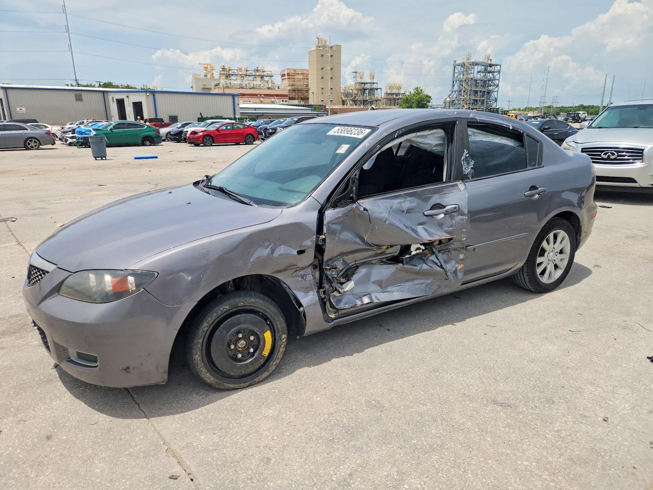 2007 Mazda 3 i Touring, VIN JM1BK32F571677636 — Side