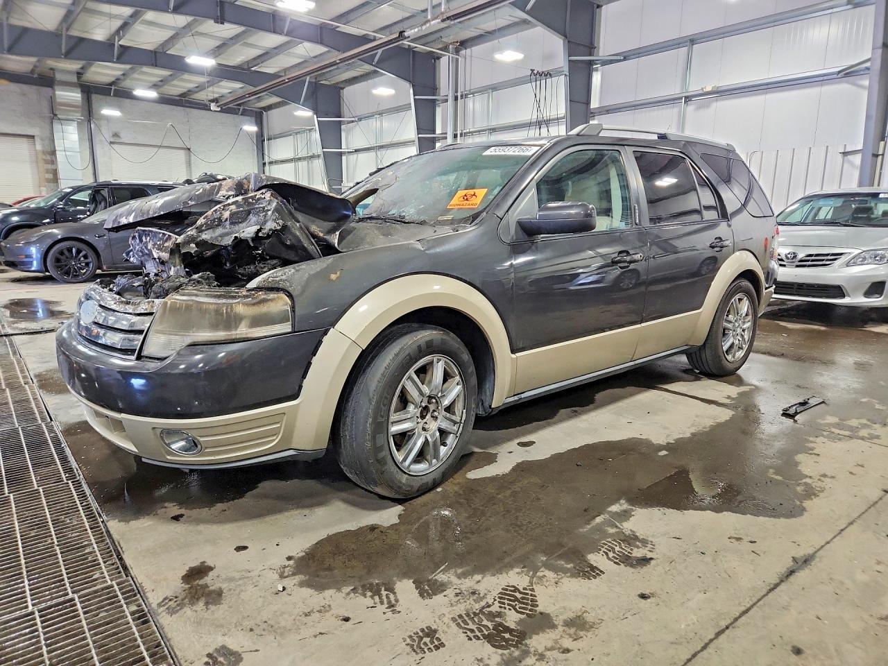 2008 Ford Taurus X Eddie Bauer, VIN 1FMDK08W98GA31153 — Engine fire
