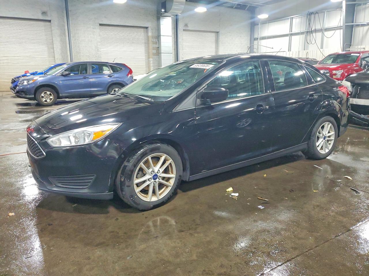 2018 Ford Focus SE, VIN 1FADP3F2XJL211297 — Side