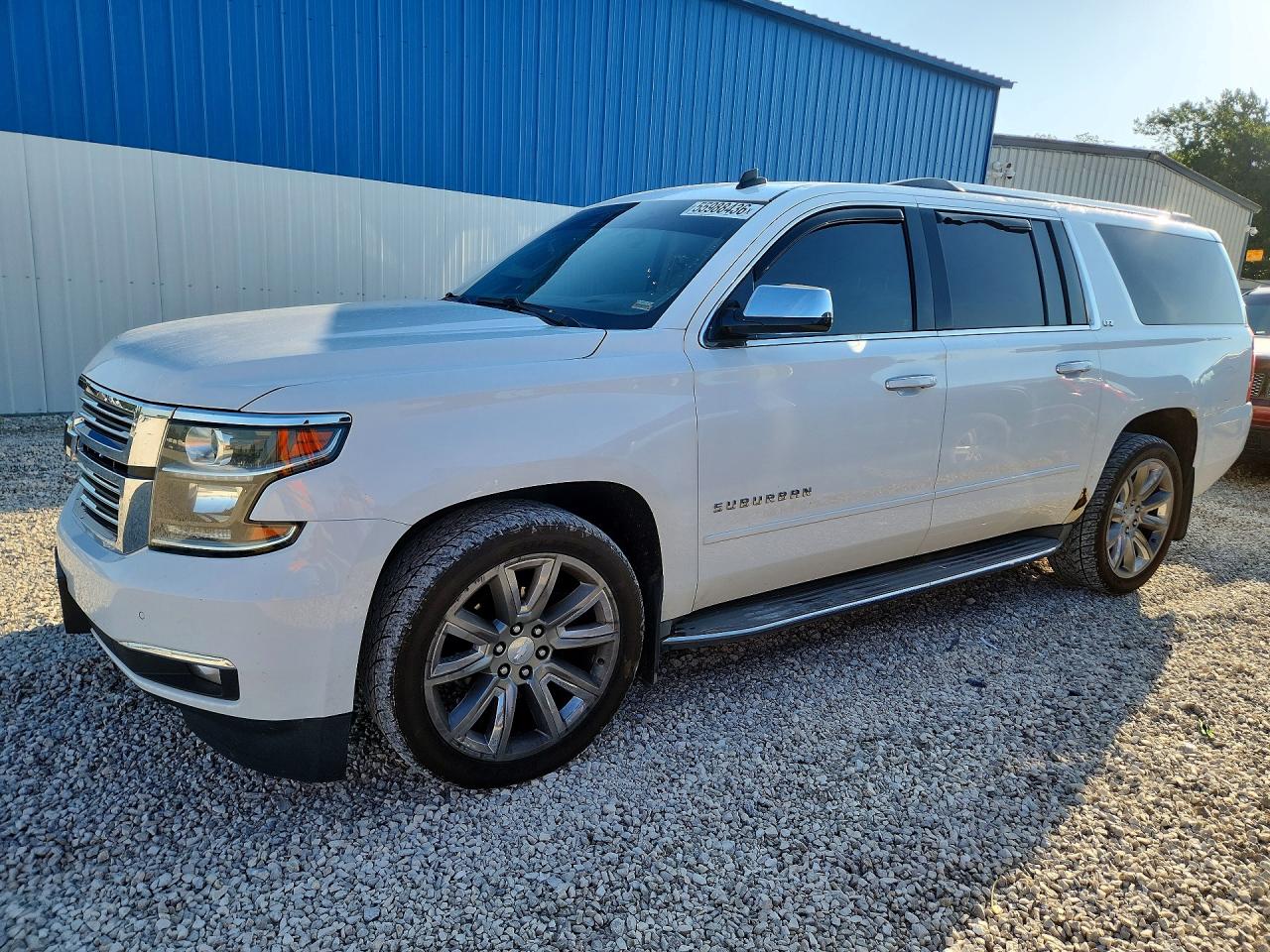 2015 Chevrolet Suburban LTZ, VIN 1GNSKKKC0FR240473 — Hail