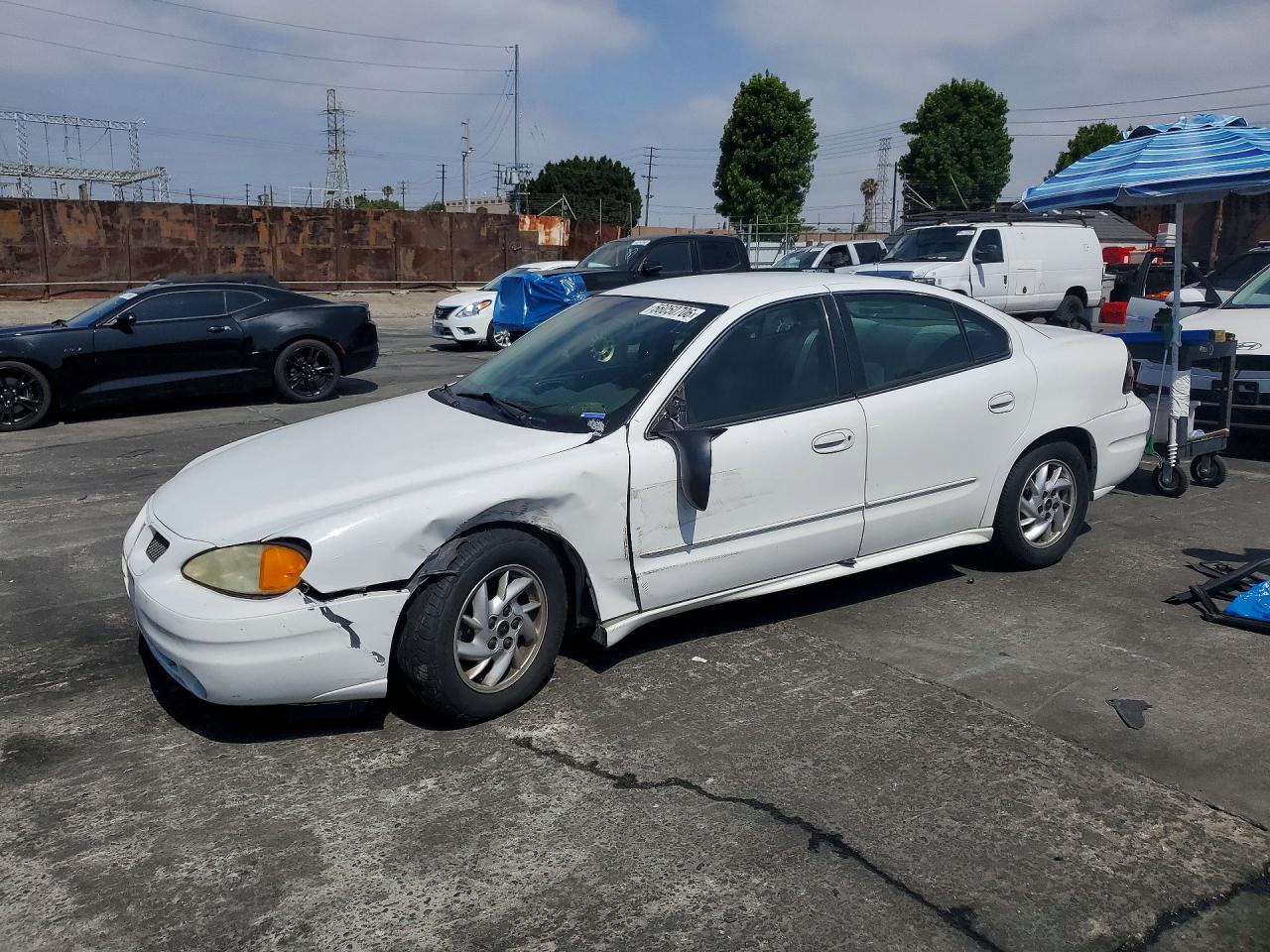 2003 Pontiac Grand Am SE1, VIN 1G2NF52FX3C296591 — Side