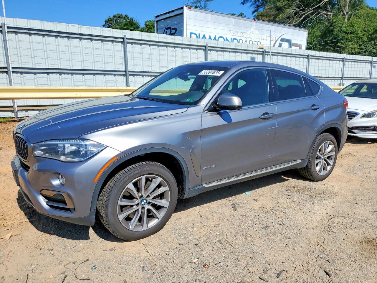 2017 BMW X6 xDrive50i, VIN 5UXKU6C33H0S99757 — Side