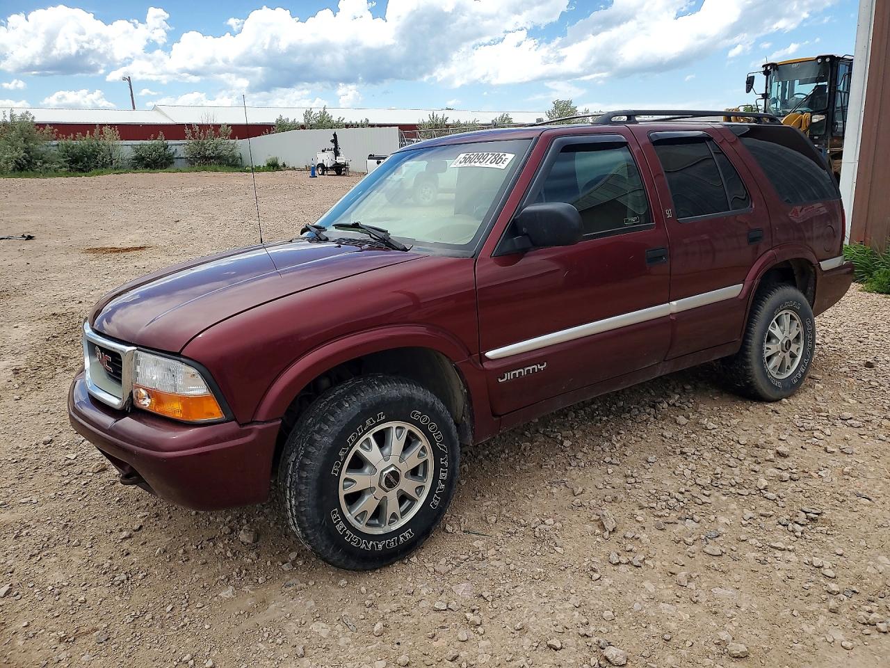 2000 GMC Jimmy SLT Convenience, VIN 1GKDT13W1Y2109554 — Side