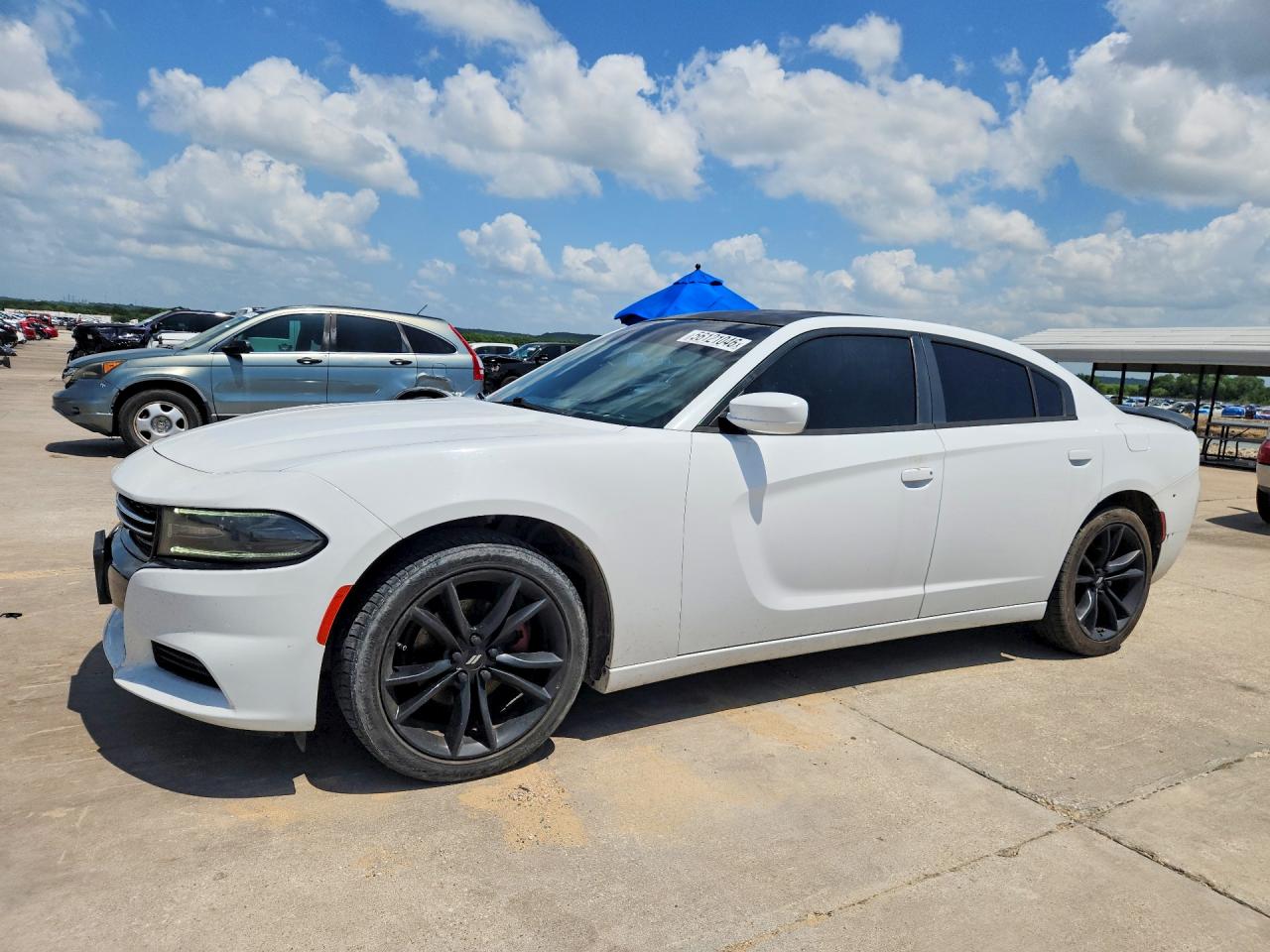2015 Dodge Charger SE, VIN 2C3CDXBG7FH721526 — Hail