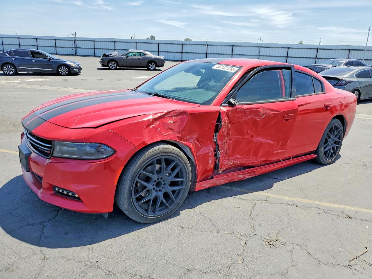 2015 Dodge Charger SE, VIN 2C3CDXBGXFH728843 — Side