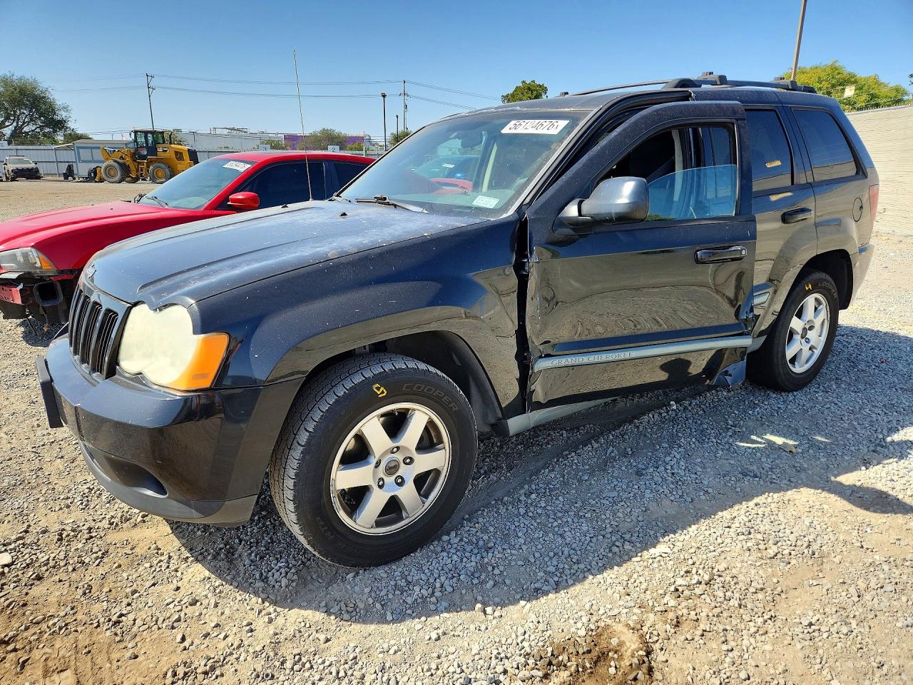2009 Jeep Grand Cherokee Laredo, VIN 1J8GS48K69C518916 — Side