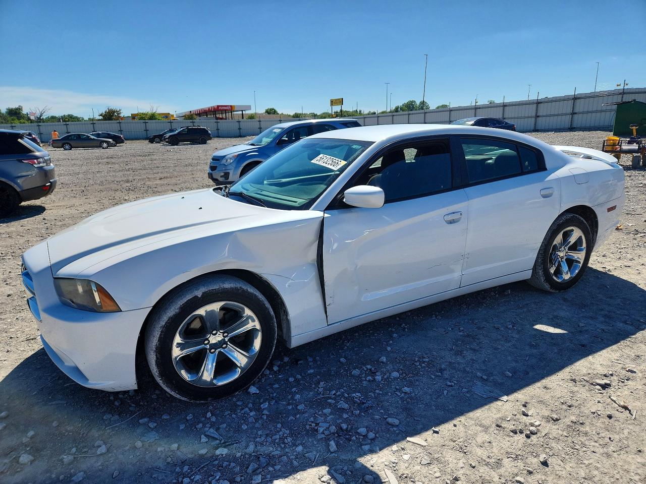 2013 Dodge Charger SE, VIN 2C3CDXBG7DH738615 — Side