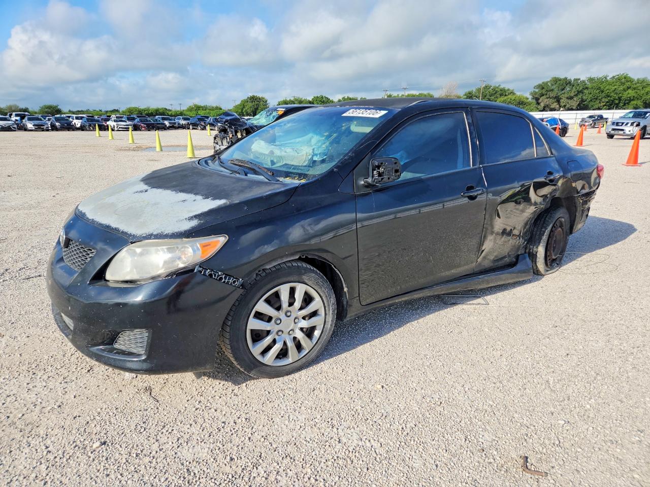 2009 Toyota Corolla LE, VIN 1NXBU40E29Z012040 — Side