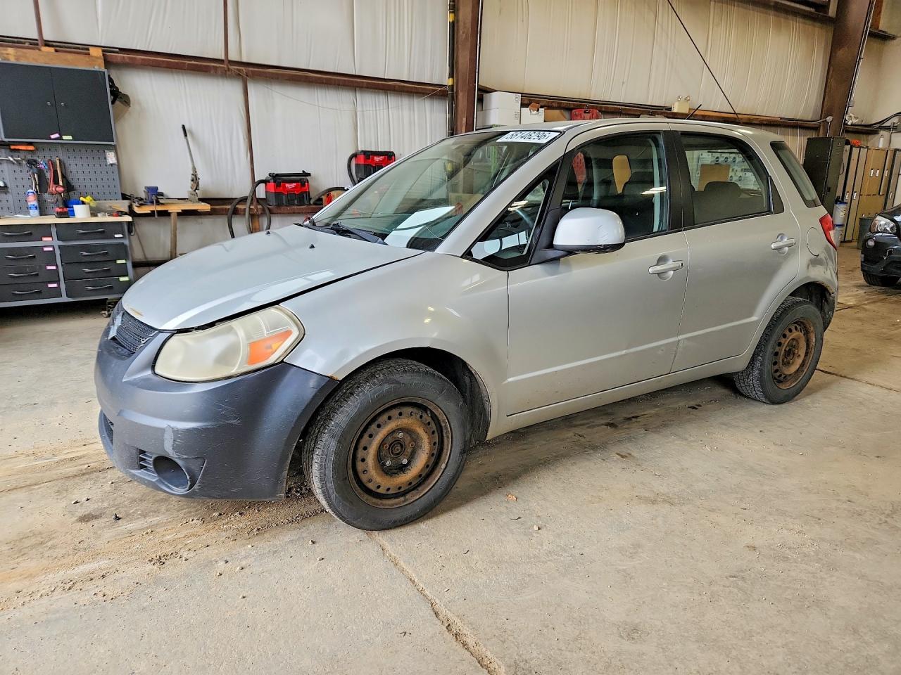 2009 Suzuki SX4, VIN JS2YA411196200089 — Перед