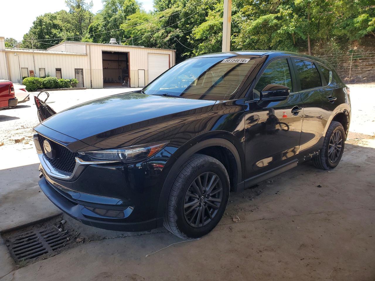 2021 Mazda CX-5 Touring, VIN JM3KFACM9M1322185 — Side