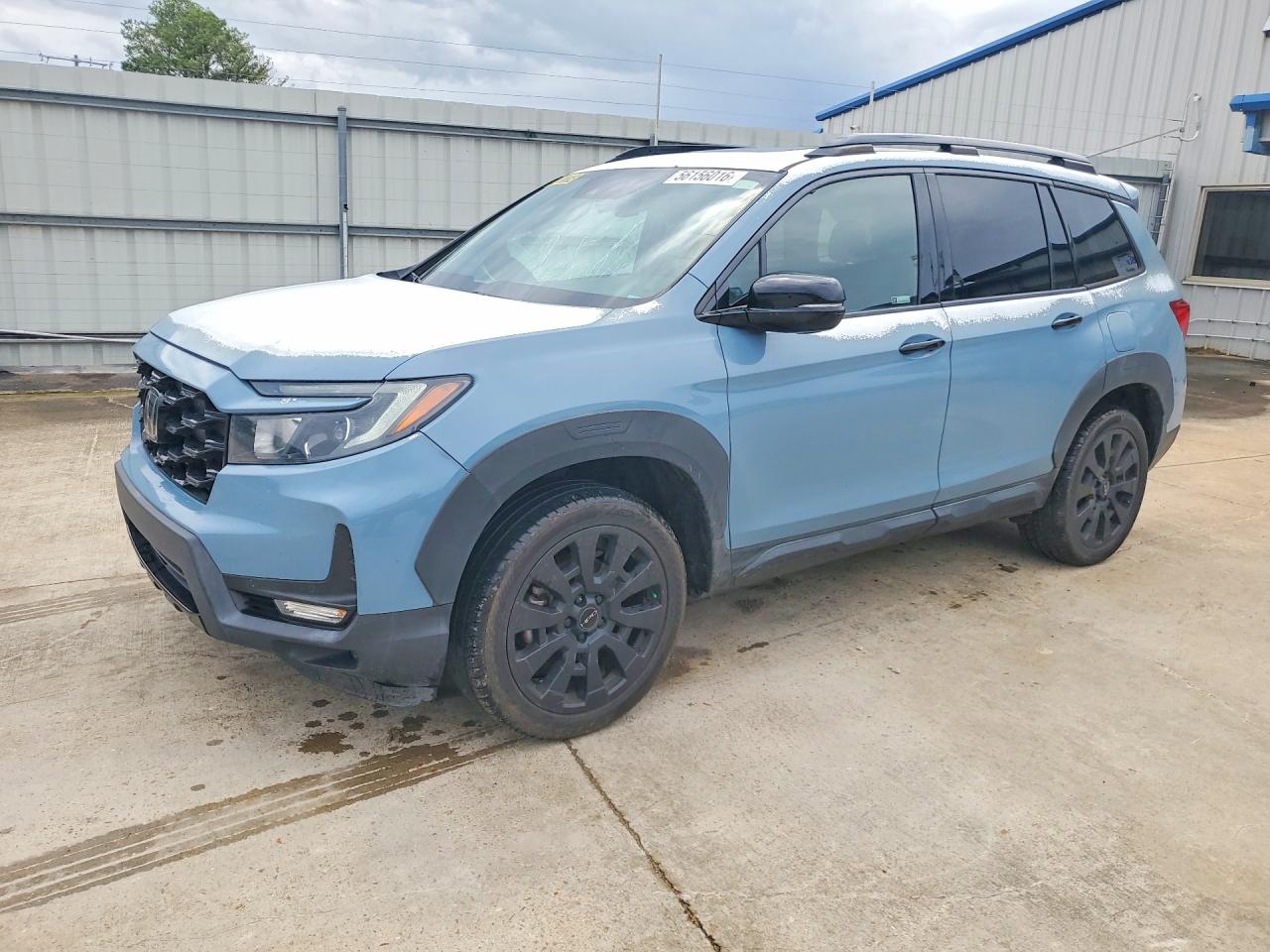 2022 Honda Passport Elite, VIN 5FNYF8H08NB014743 — Side