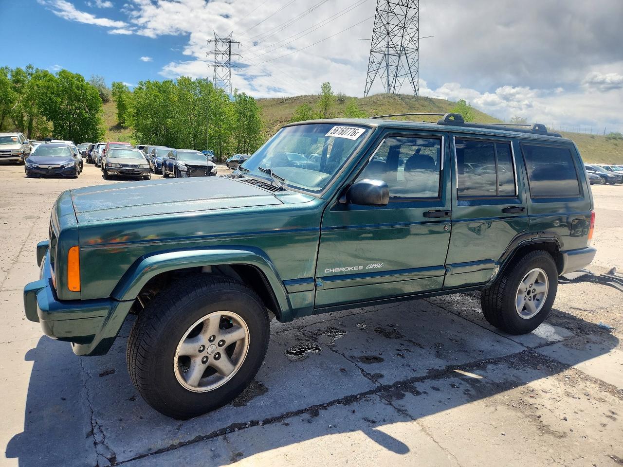 1999 Jeep Cherokee Sport, VIN 1J4FF68S5XL607970 — Side