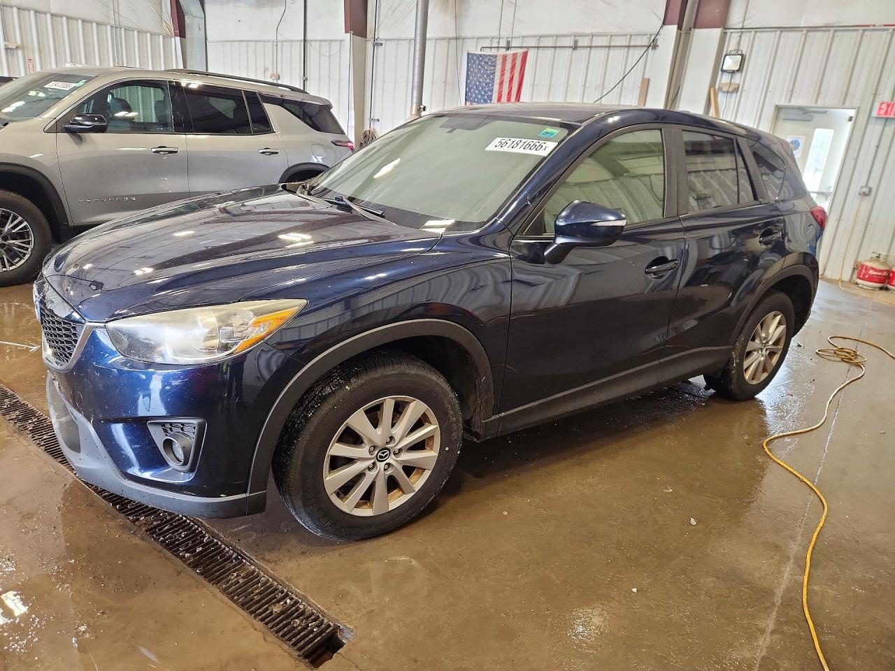 2015 Mazda CX-5 Touring, VIN JM3KE2CY9F0502254 — Burn