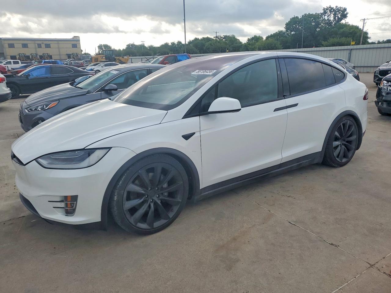 2021 Tesla Model X Long Range Plus, VIN 5YJXCBE29MF322851 — Side
