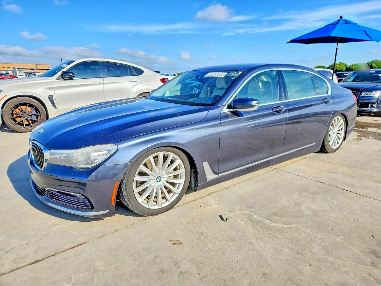 2016 BMW 7 Series 740i, VIN WBA7E2C59GG547575 — Hail