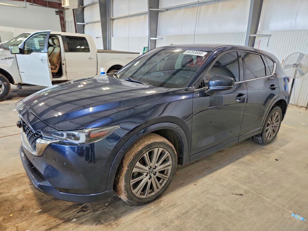2023 Mazda CX-5 Signature, VIN JM3KFBXYXP0126172 — Бок