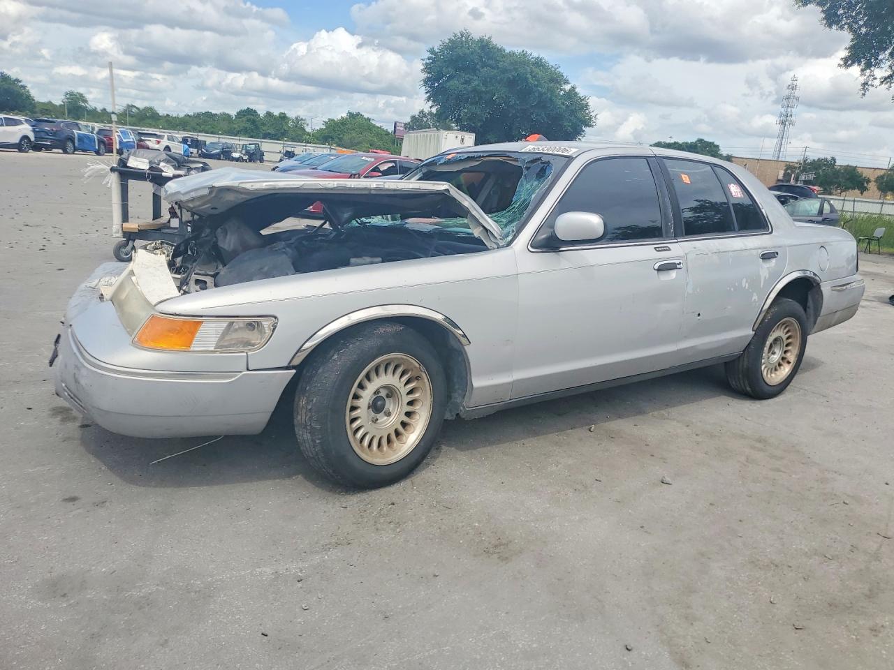 1999 Mercury Grand Marquis LS, VIN 2MEFM75W0XX704844 — Rollover