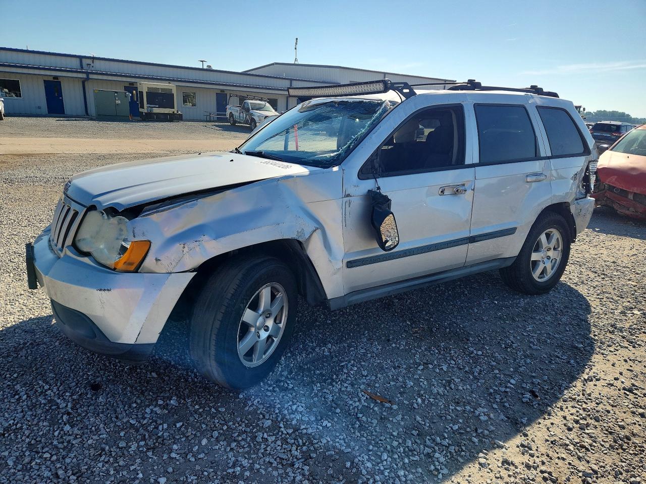2009 Jeep Grand Cherokee Laredo, VIN 1J8GR48K49C531157 — Side