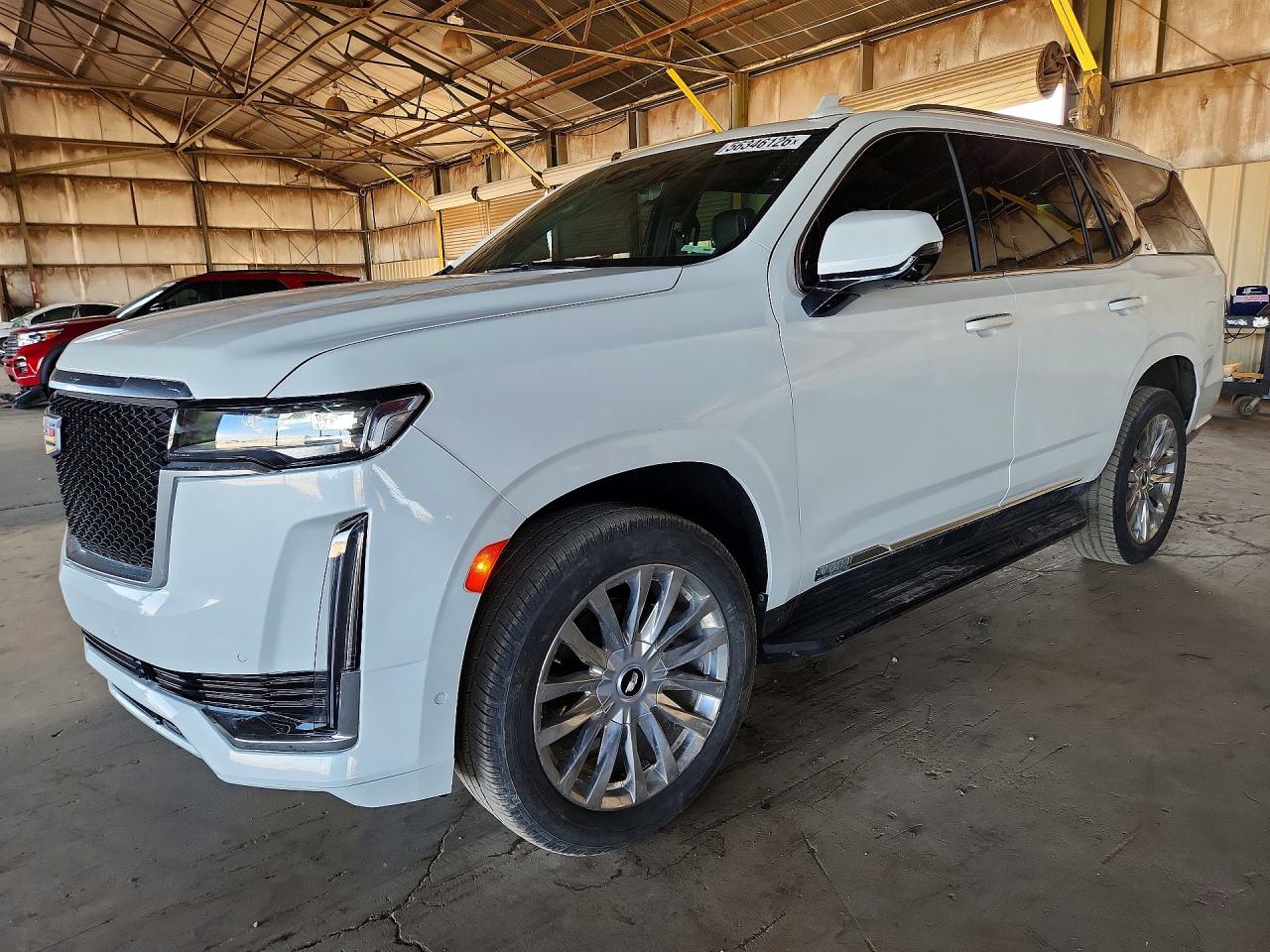2021 Cadillac Escalade Premium Luxury, VIN 1GYS4BKLXMR310698 — Minor dents and scratches