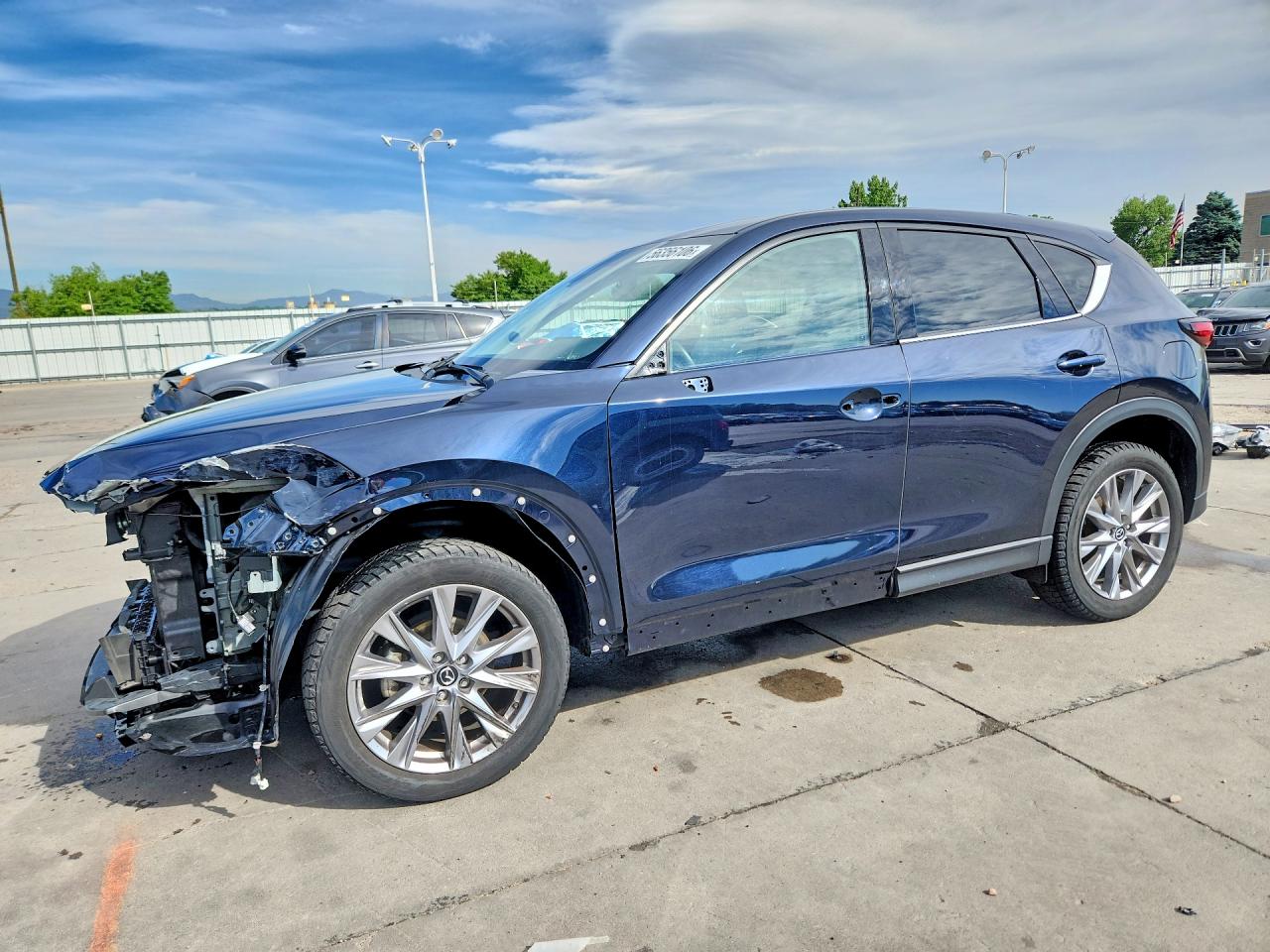 2021 Mazda CX-5 Grand Touring, VIN JM3KFADM0M1322994 — Front end