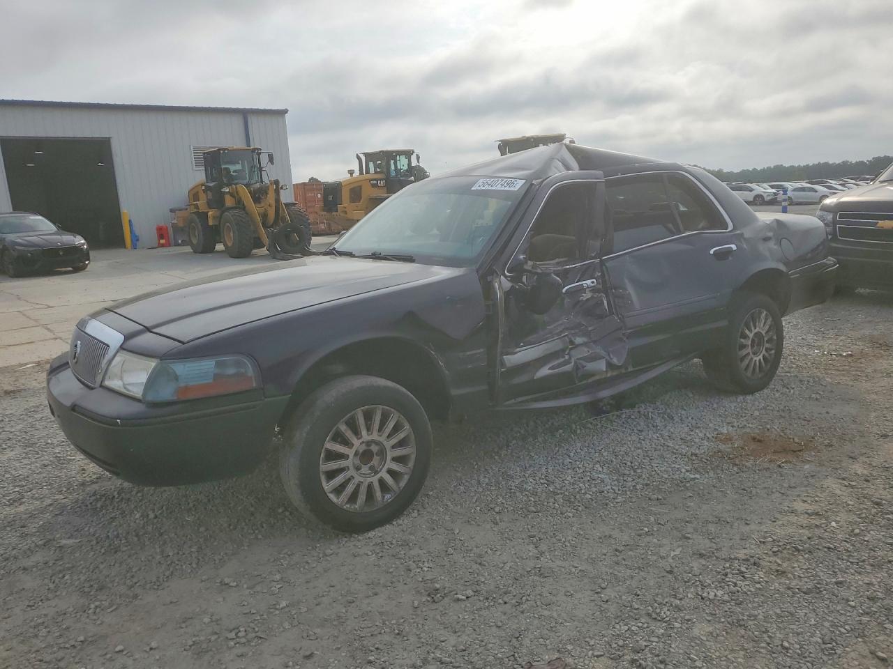 2003 Mercury Grand Marquis GS Convenience, VIN 2MEFM74W53X606517 — Side