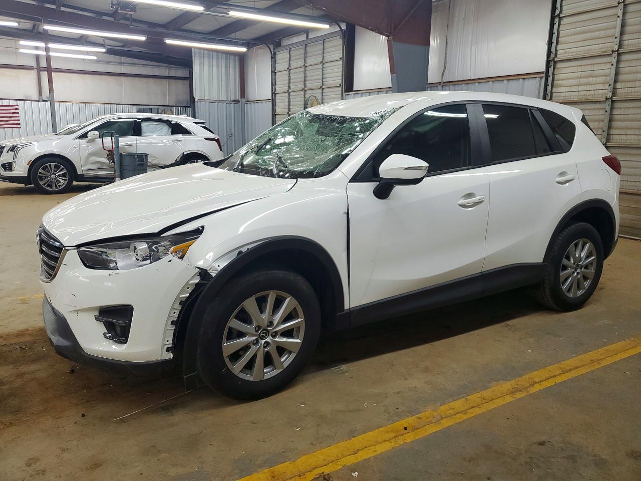 2016 Mazda CX-5 Touring, VIN JM3KE2CY0G0843897 — Rollover