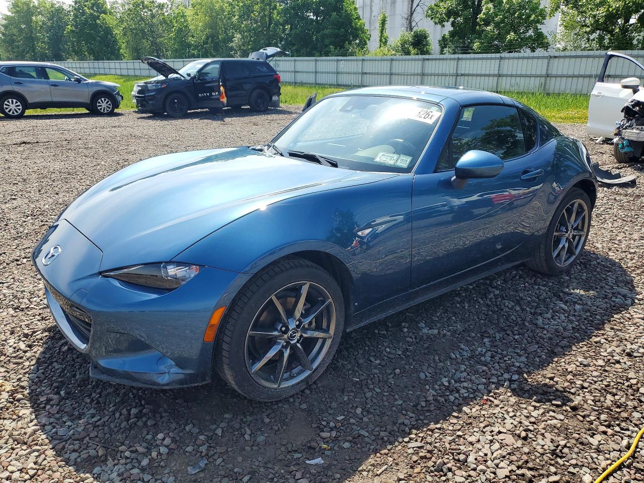 2019 Mazda MX-5 Miata Grand Touring, VIN JM1NDAM78K0301139 — Side