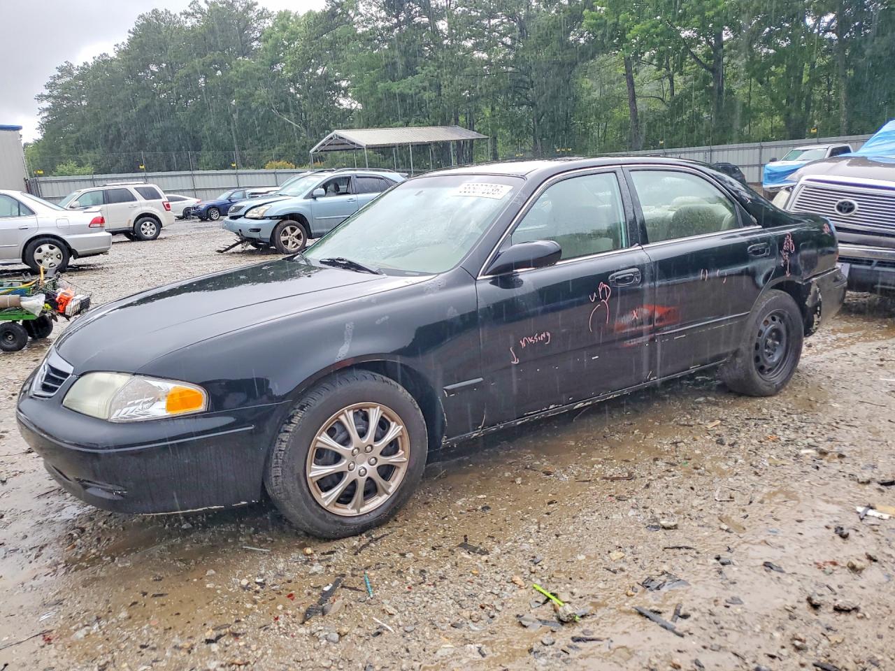 2000 Mazda 626 LX, VIN 1YVGF22C9Y5130870 — Rear end