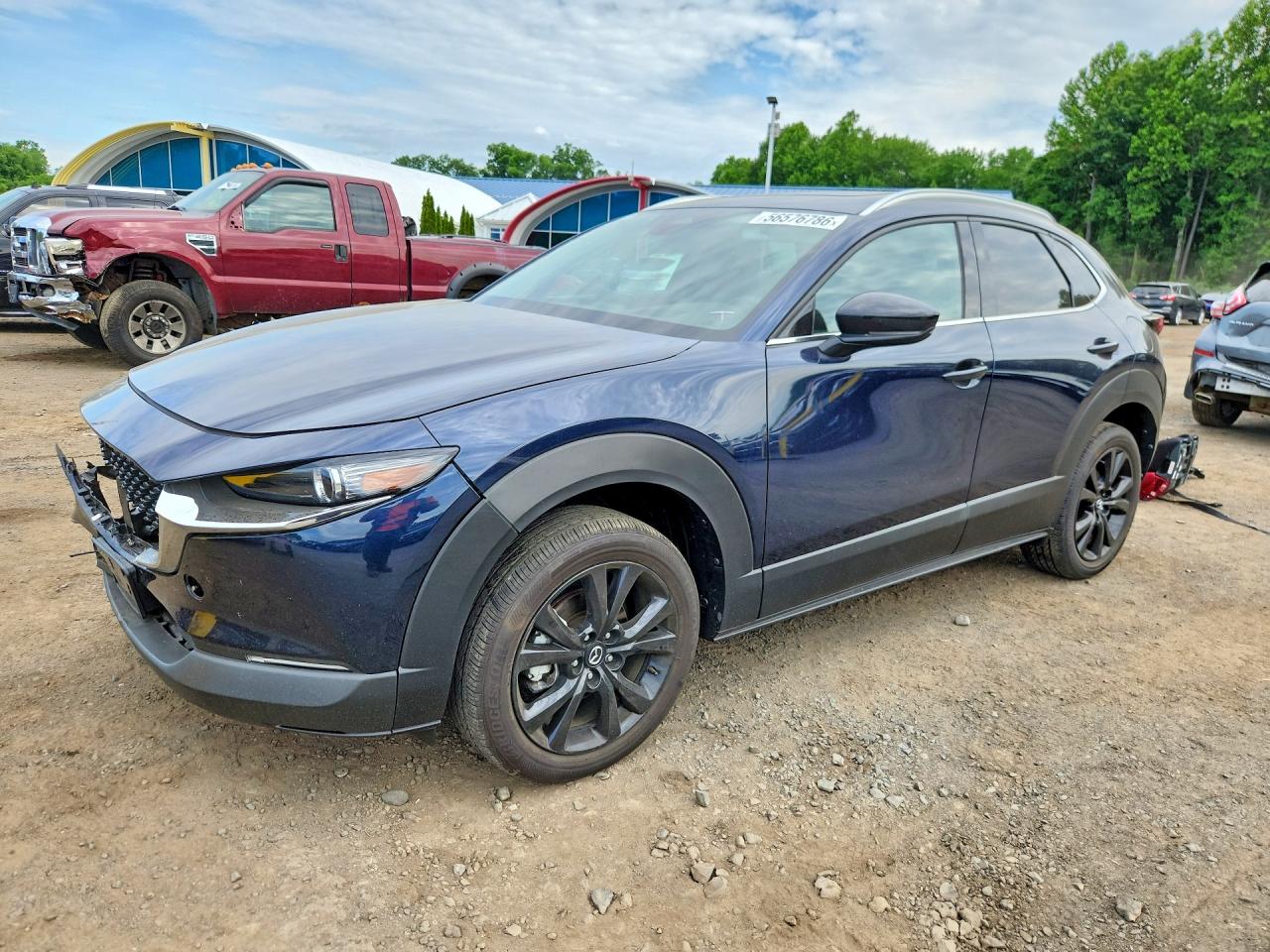 2024 Mazda CX-30 Premium, VIN 3MVDMBDY6RM668928 — Front end