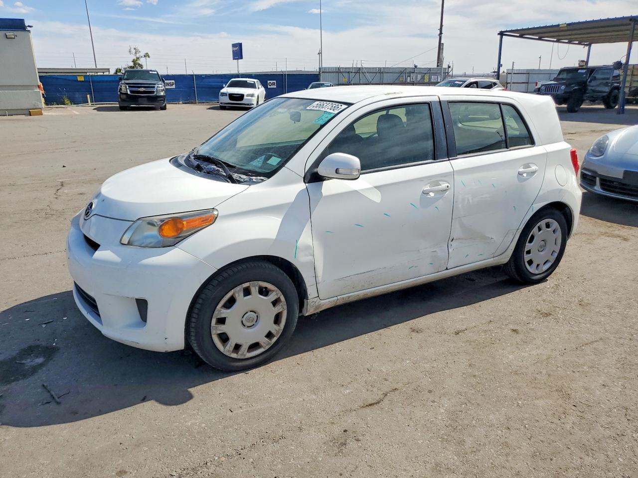 2014 Scion xD, VIN JTKKUPB40E1040840 — Side