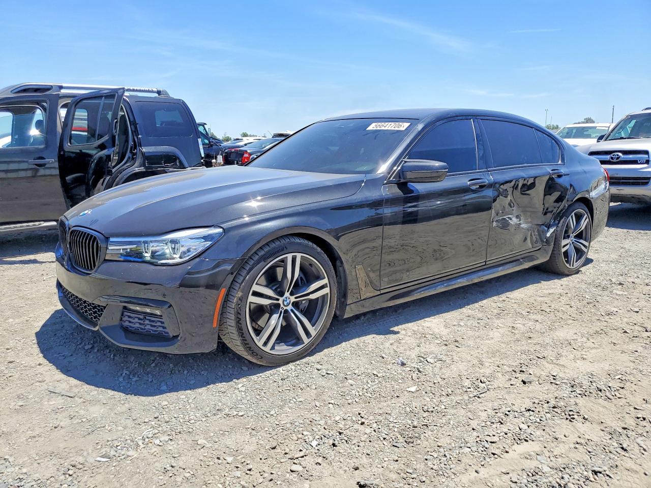 2016 BMW 7 Series 740i, VIN WBA7E2C58GG547440 — Side