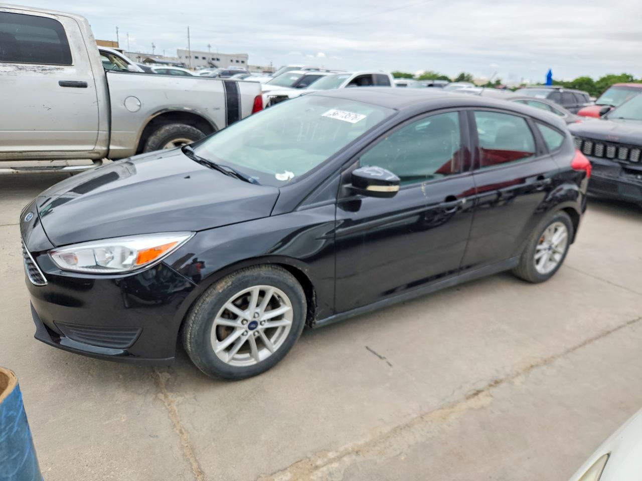 2015 Ford Focus SE, VIN 1FADP3K23FL377092 — Hail