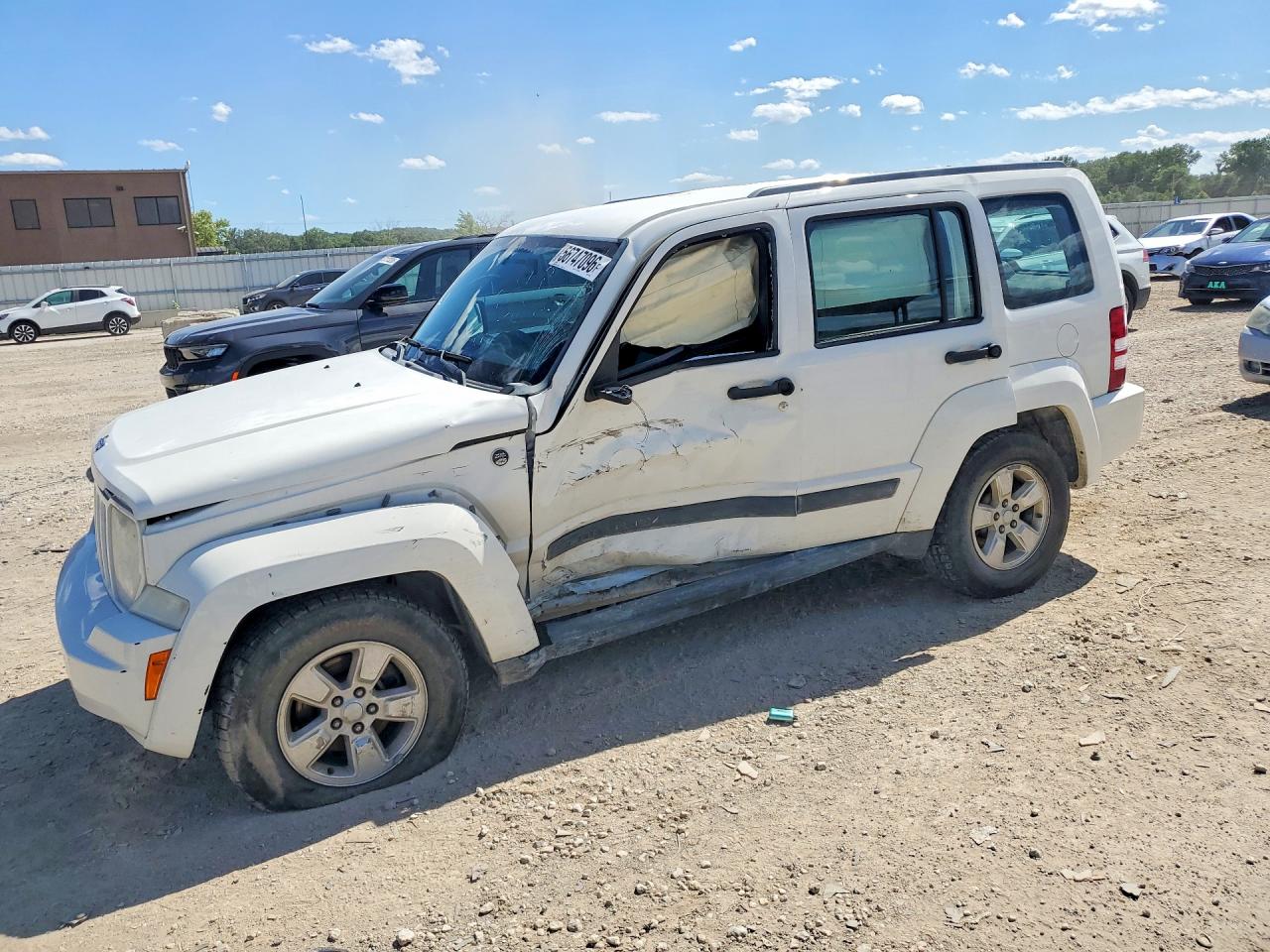 2010 Jeep Liberty Sport, VIN 1J4PN2GK1AW146421 — Side