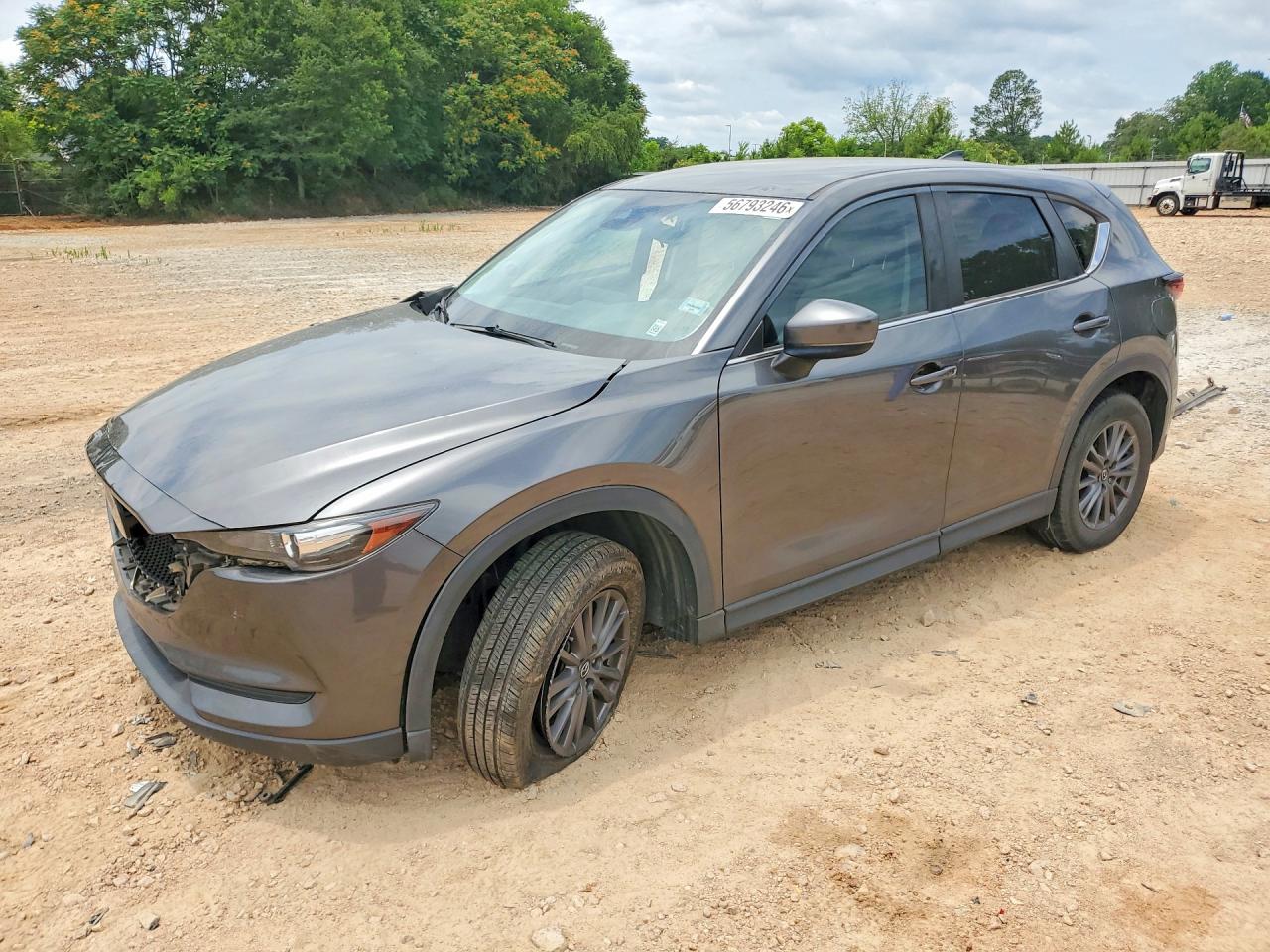 2021 Mazda CX-5 Touring, VIN JM3KFACM4M1313684 — Side