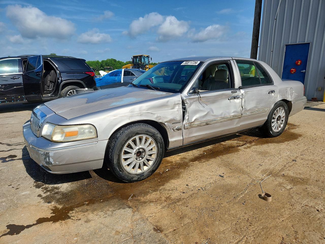 2010 Mercury Grand Marquis LS, VIN 2MEBM7FV9AX609016 — Side
