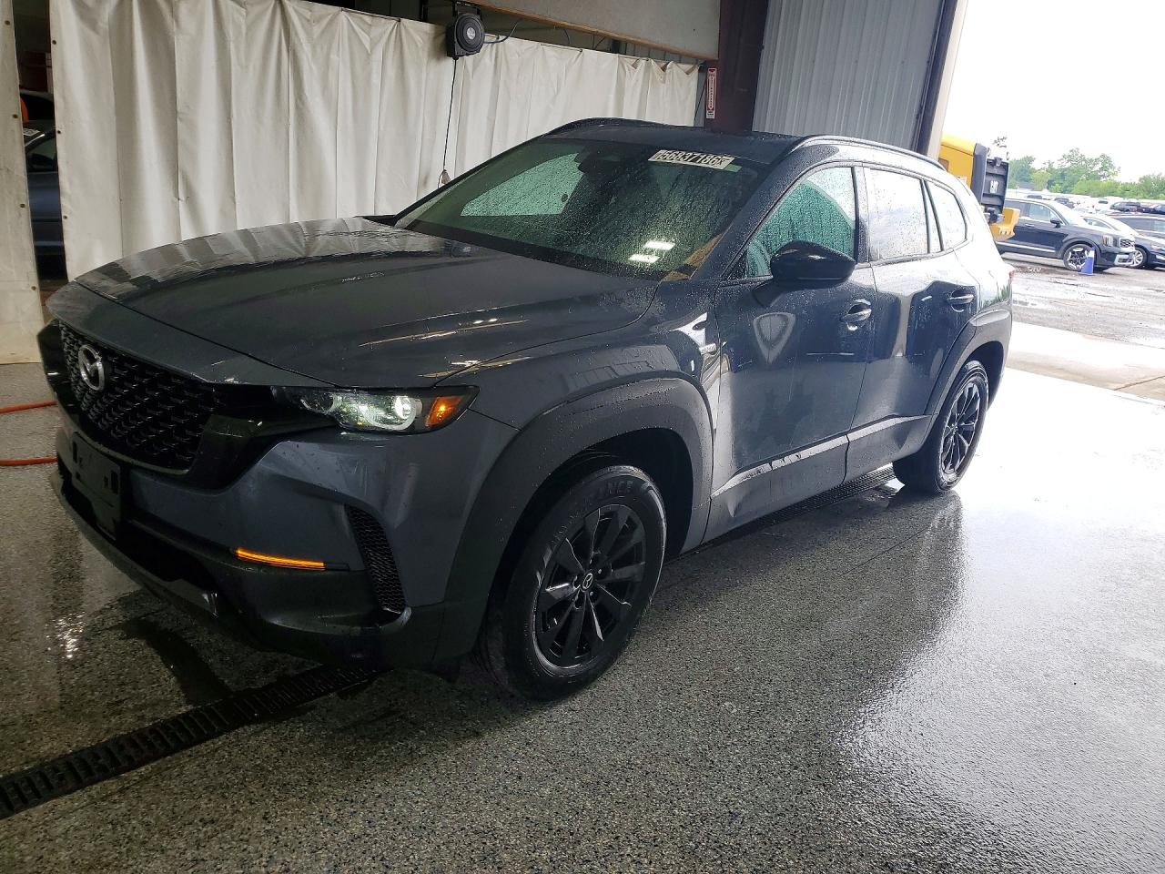 2025 Mazda CX-50 Hybrid Premium Package, VIN 7MMVAADW1SN131354 — Side