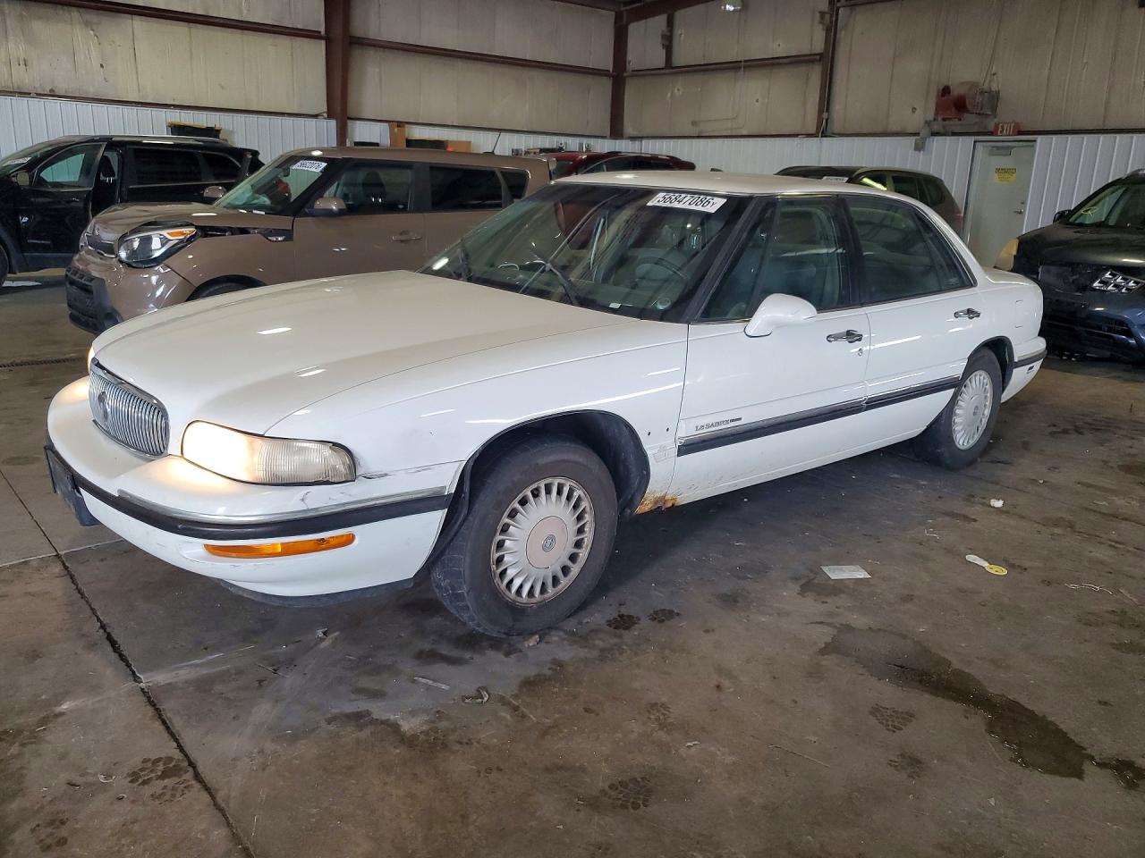 1997 Buick LeSabre Custom, VIN 1G4HP52K4VH564071 — Side