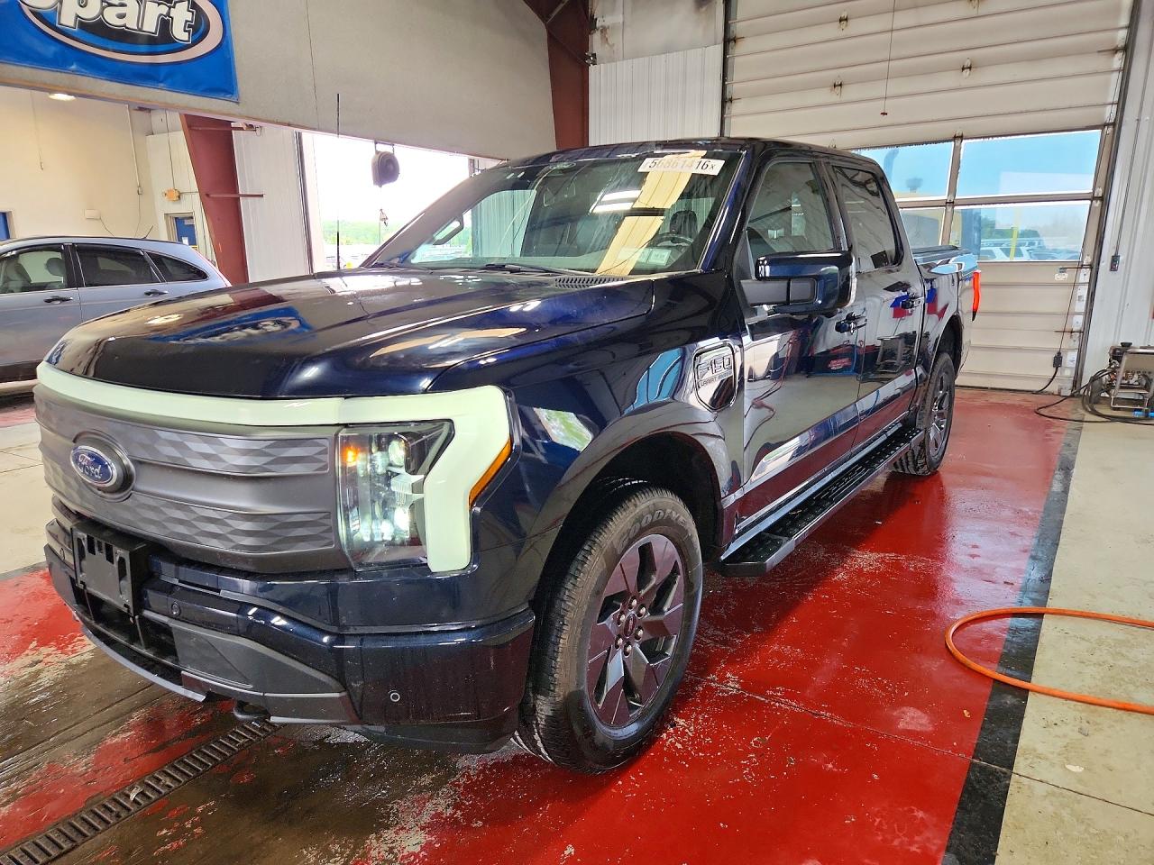 2022 Ford F-150 Lightning XLT, VIN 1FTVW1EL0NWG10711 — Hail