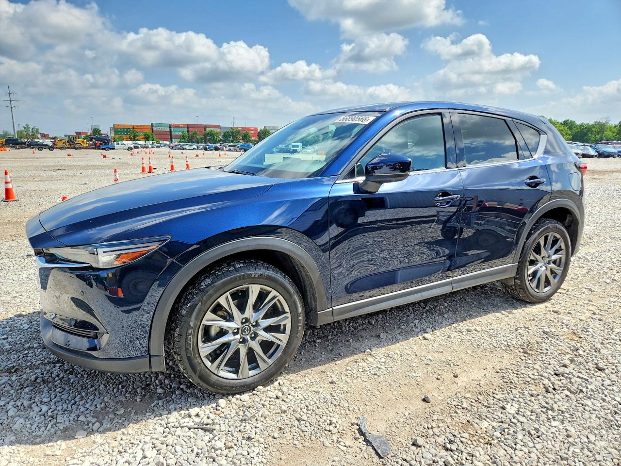 2021 Mazda CX-5 Signature, VIN JM3KFBEY2M0489659 — Hail