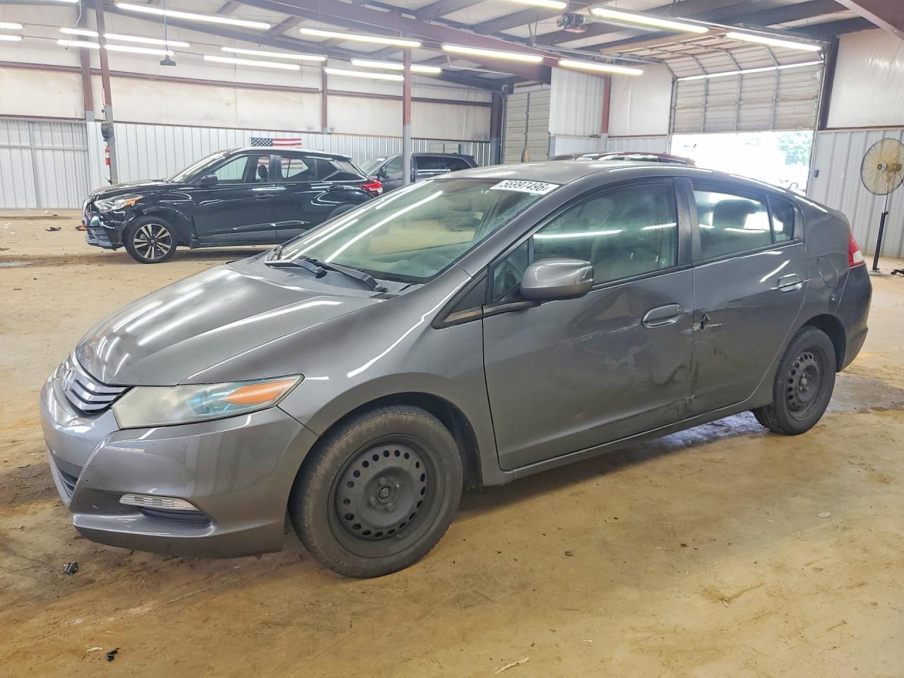 2011 Honda Insight LX, VIN JHMZE2H53BS005770 — Side