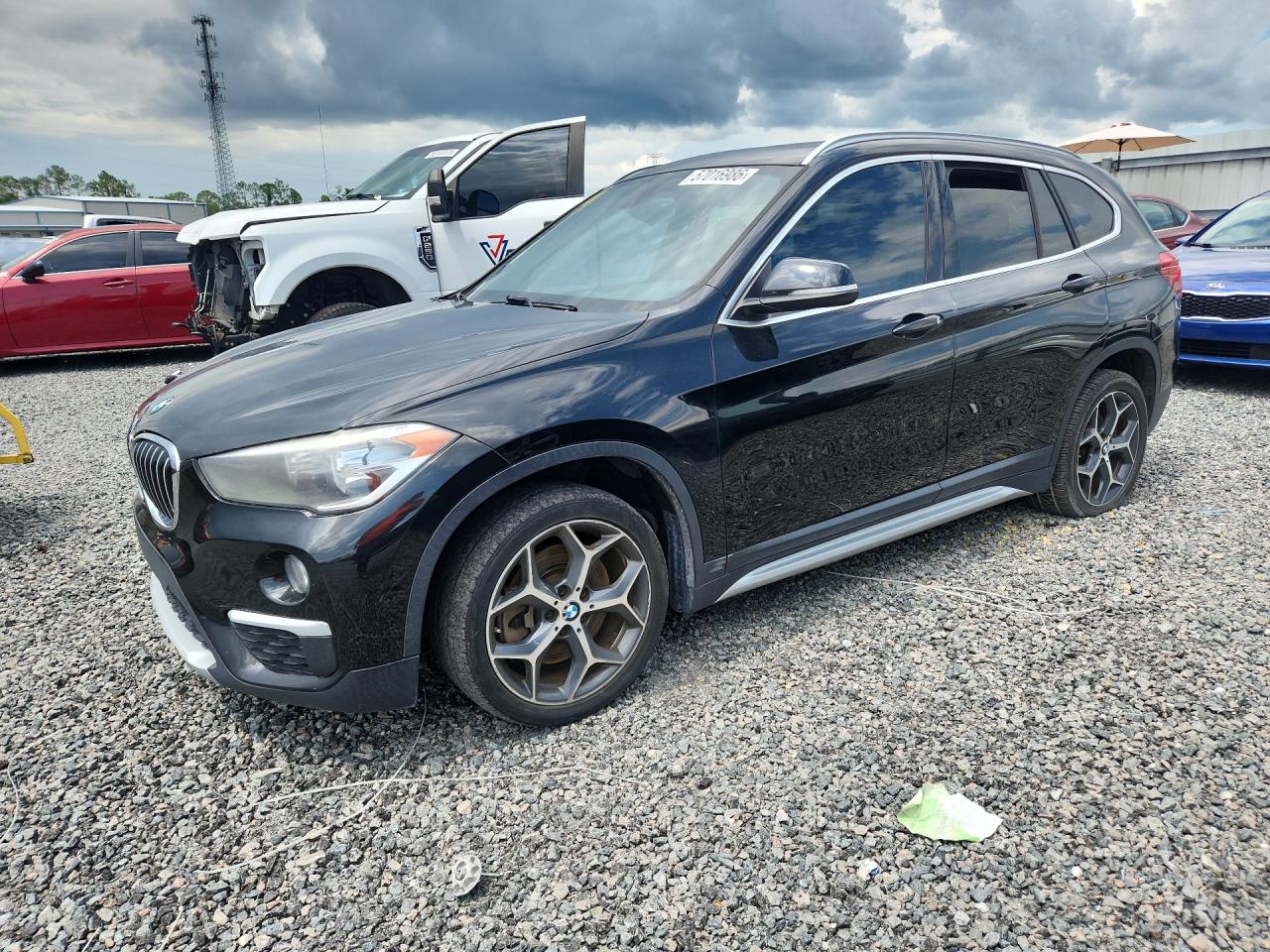 2018 BMW X1 sDrive28i, VIN WBXHU7C30J3H43138 — Side