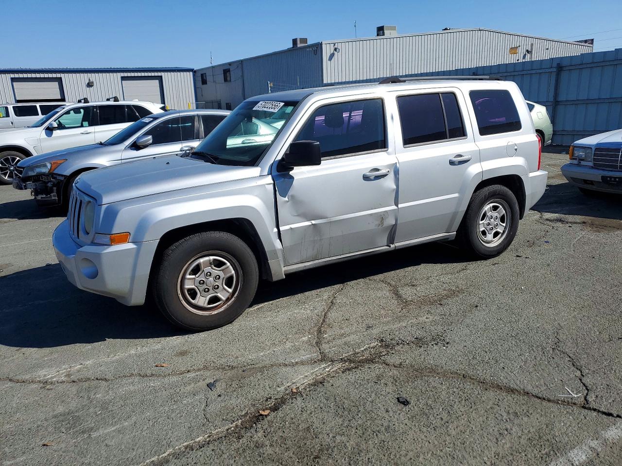 2010 Jeep Patriot Sport, VIN 1J4NT2GB8AD660050 — Side