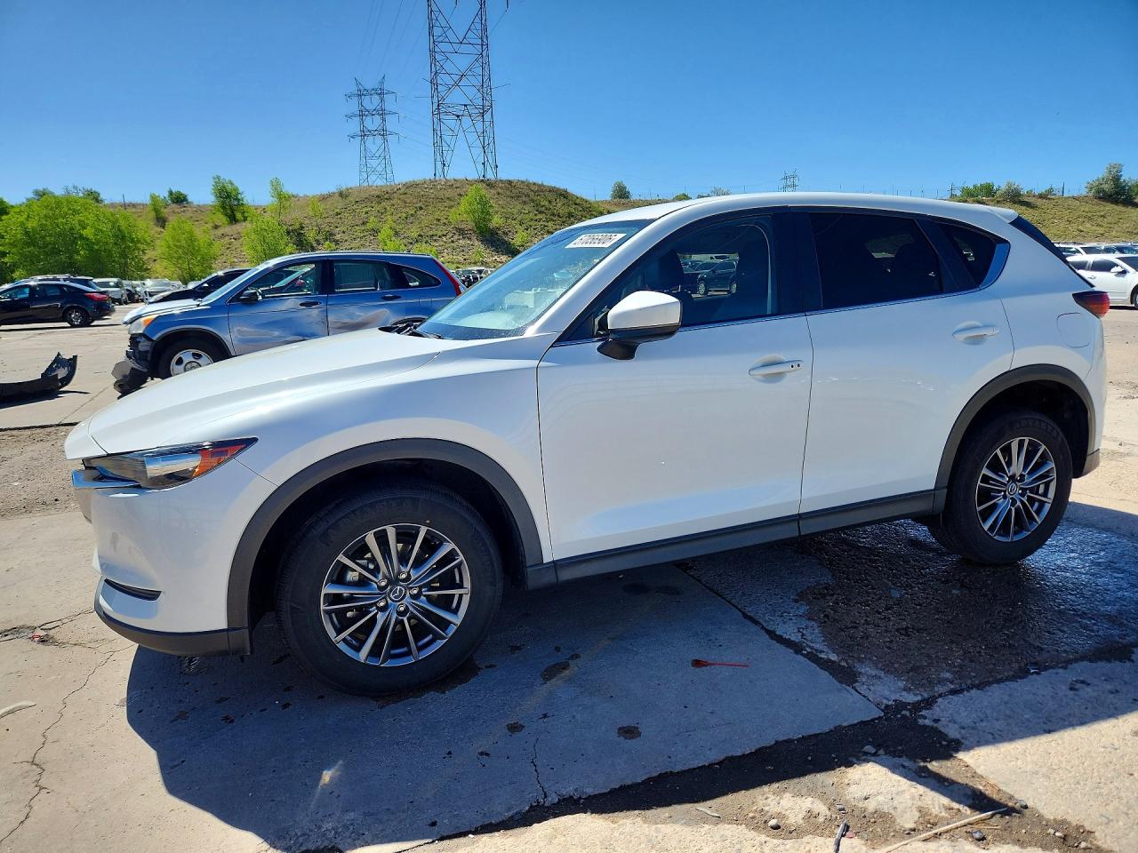 2021 Mazda CX-5 Touring, VIN JM3KFBCM7M0456026 — Side