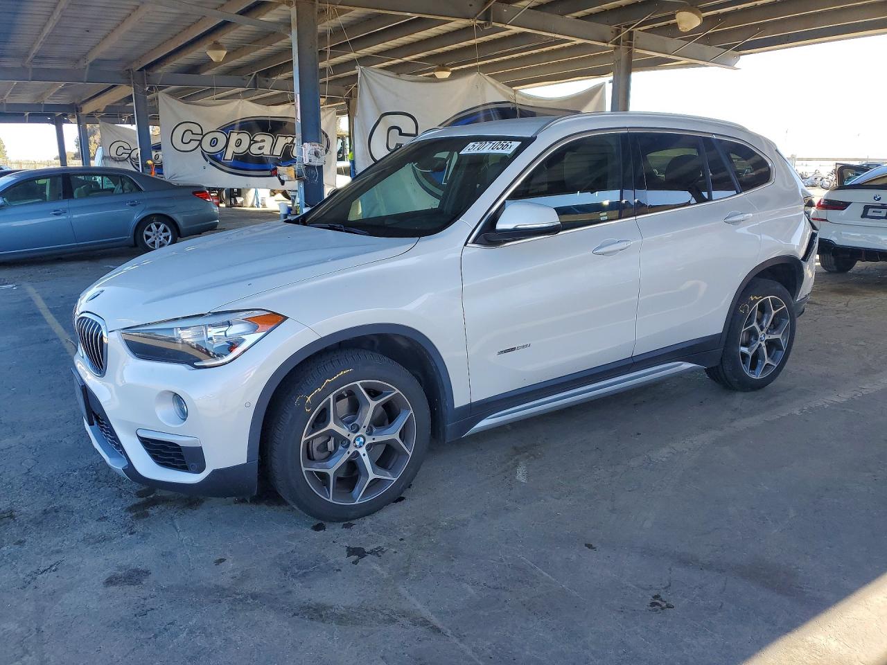 2018 BMW X1 sDrive28i, VIN WBXHU7C37J5H40662 — Rear end