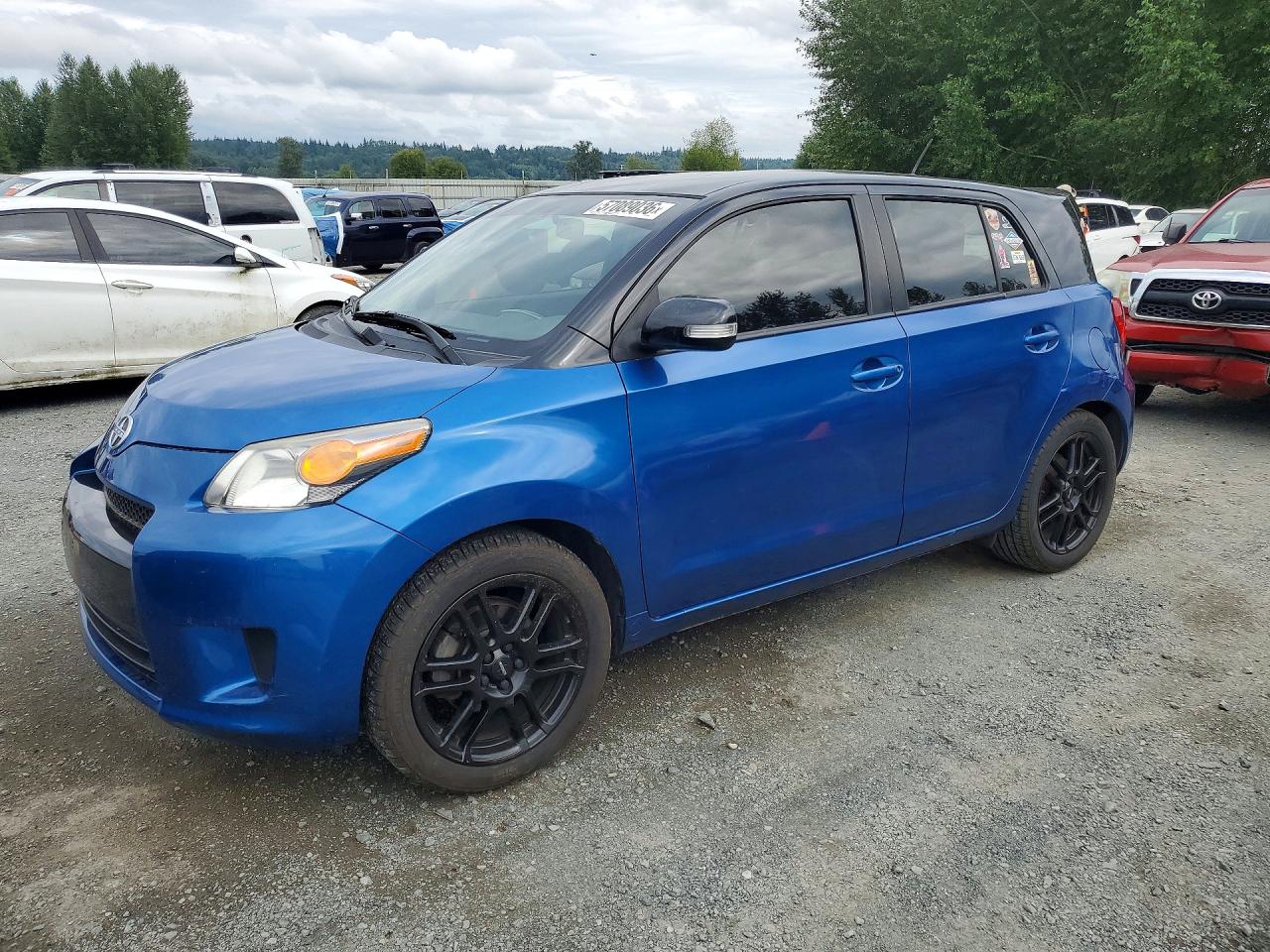 2013 Scion xD, VIN JTKKUPB46D1034488 — Side