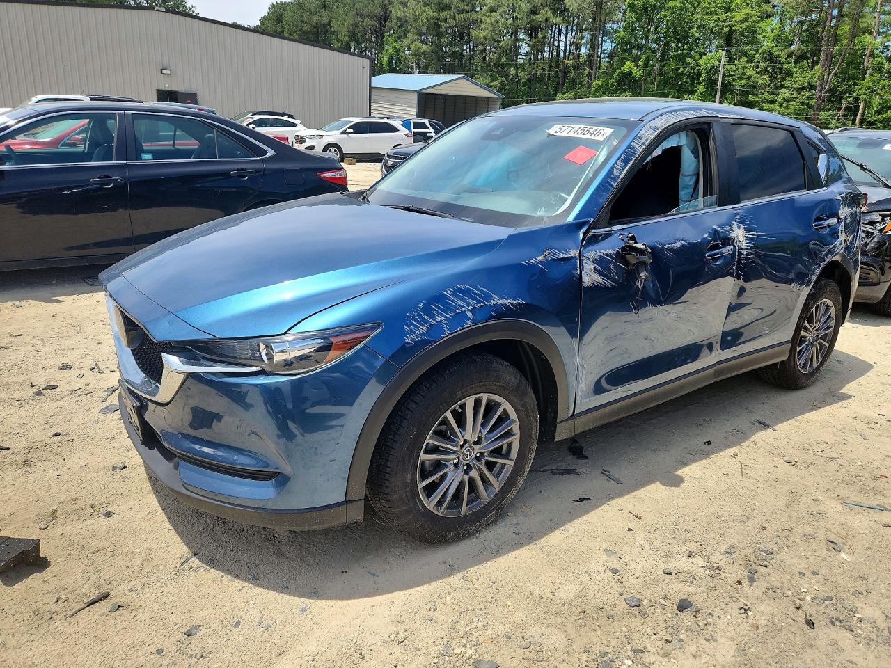 2020 Mazda CX-5 Touring, VIN JM3KFBCM0L0801539 — Side