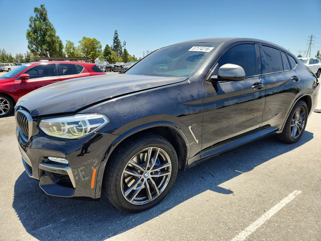 2019 BMW X4 M40i, VIN 5UXUJ5C50KLJ64402 — Rear end