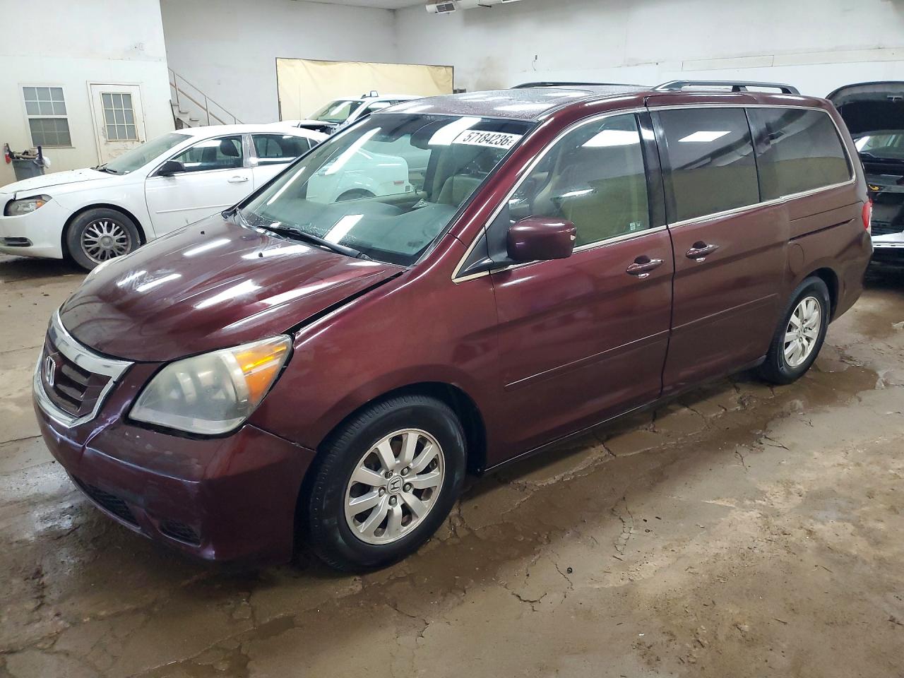 2010 Honda Odyssey EX-L, VIN 5FNRL3H7XAB100918 — Front end