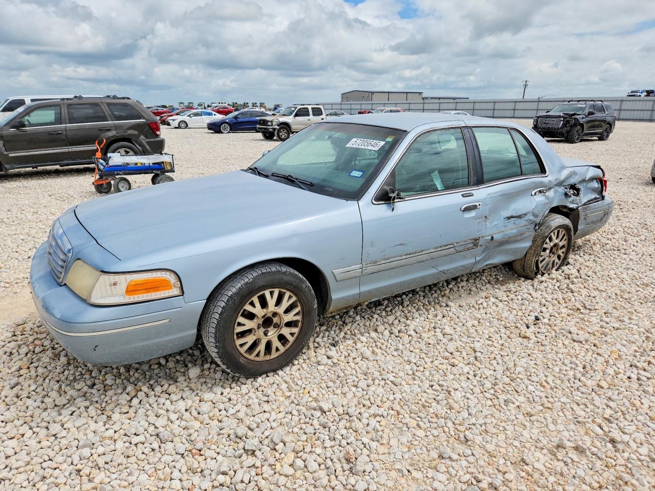 2003 Ford Crown Victoria LX, VIN 2FAFP74W73X130625 — Side