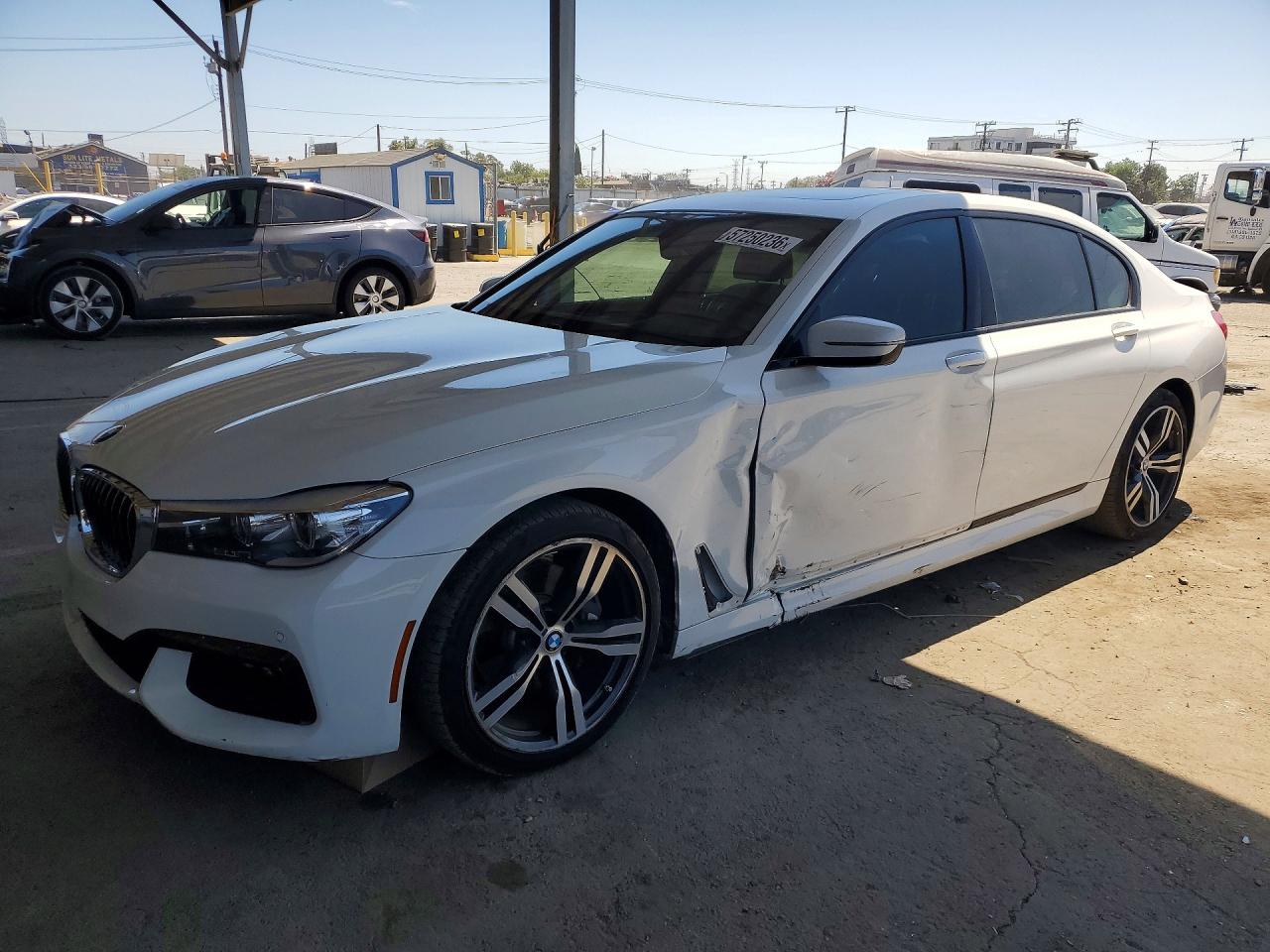 2016 BMW 7 Series 740i, VIN WBA7E2C51GG547344 — Side